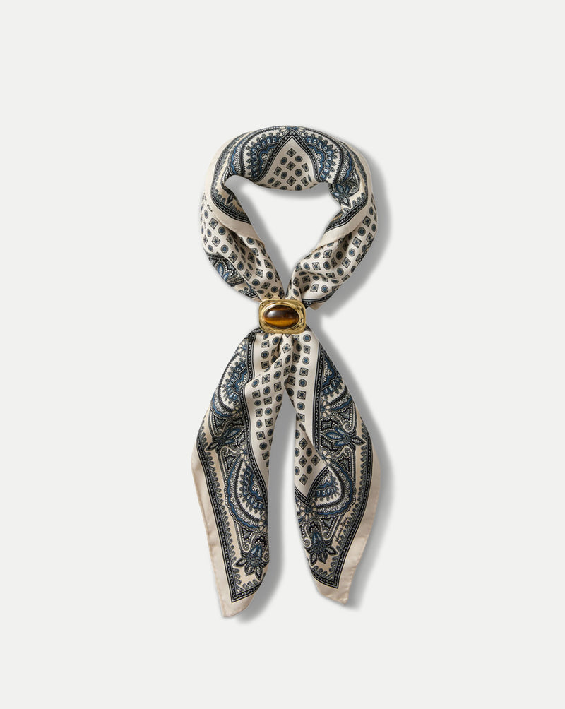 Veronica Beard Cream and blue patterned silk scarf with a brown stone ring.