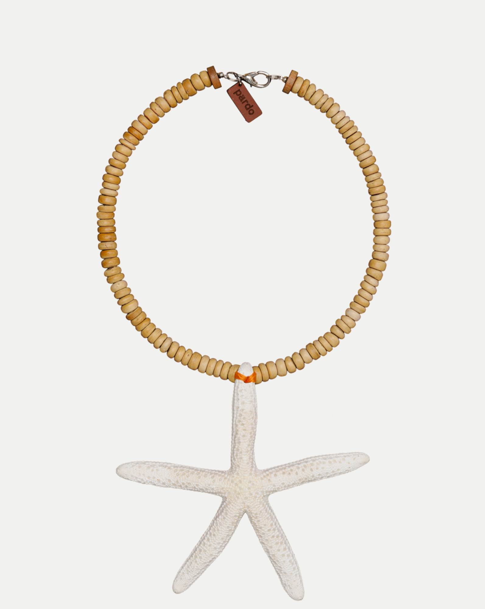Veronica Beard Wooden beaded necklace with white starfish pendant.