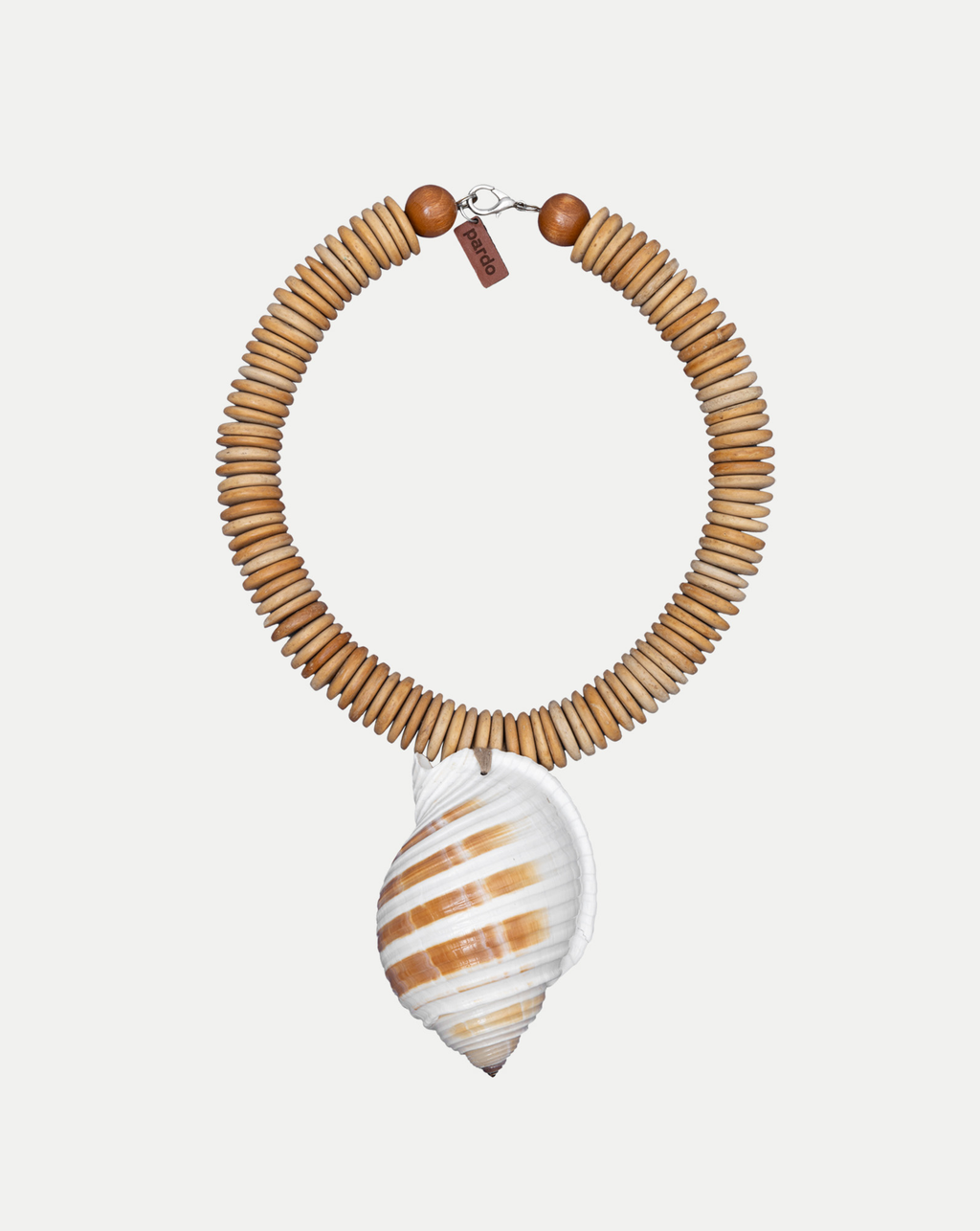 Veronica Beard Wooden beaded necklace with a large spiral seashell pendant.