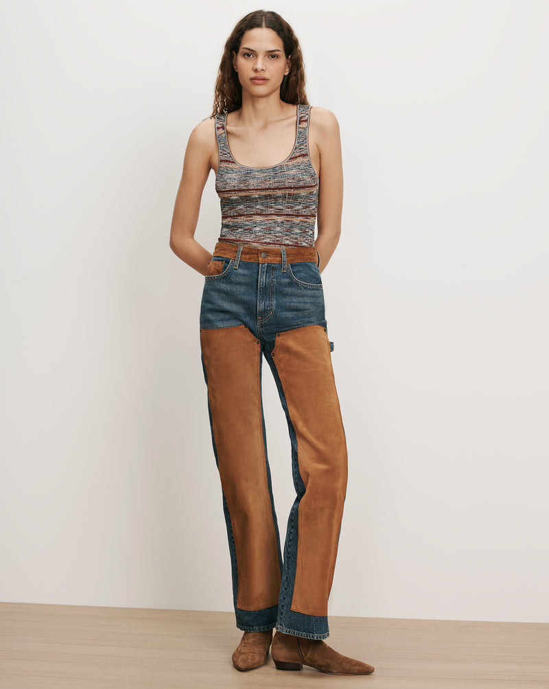 Veronica Beard Multicolor knit tank top and blue jeans with brown suede chaps.