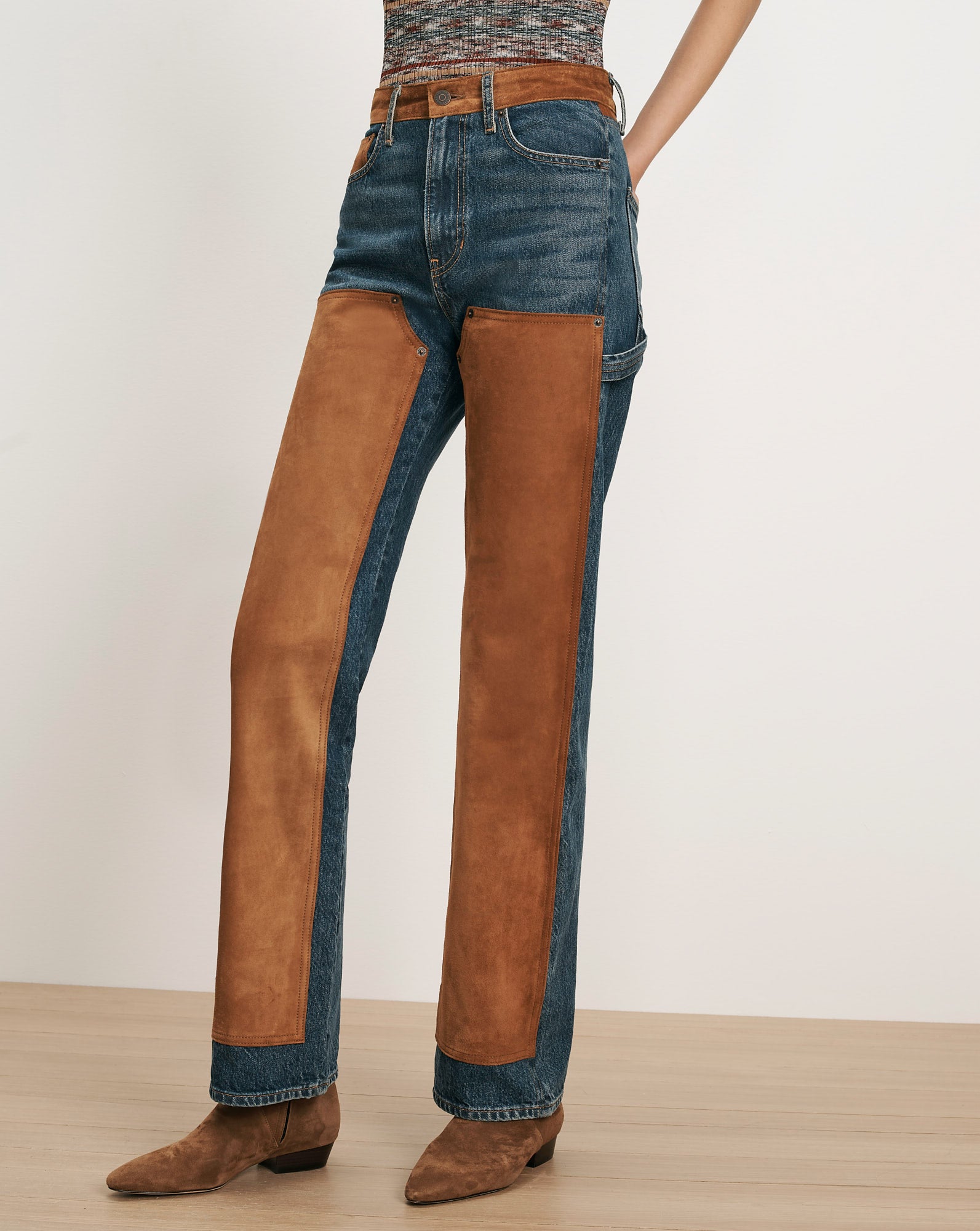 Veronica Beard Blue denim jeans with brown suede chaps.