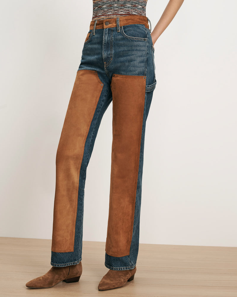 Veronica Beard Blue denim jeans with brown suede chaps.