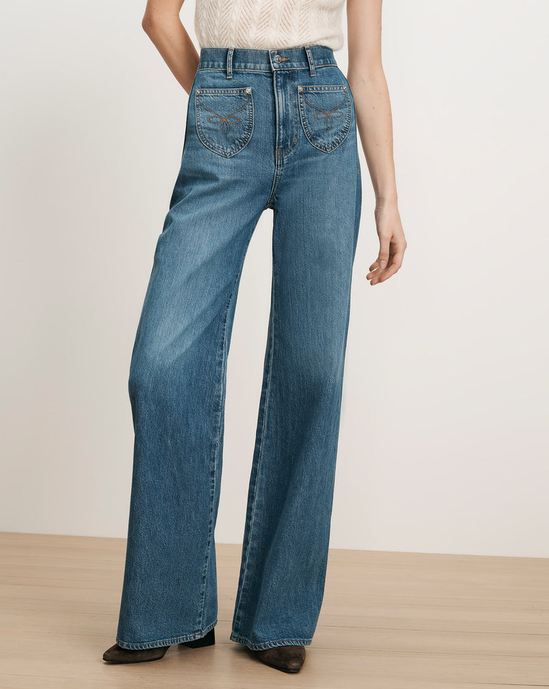 Veronica Beard Blue denim wide-leg jeans with embroidered back pockets.