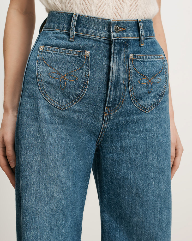 Veronica Beard Blue denim jeans with heart-shaped back pockets.
