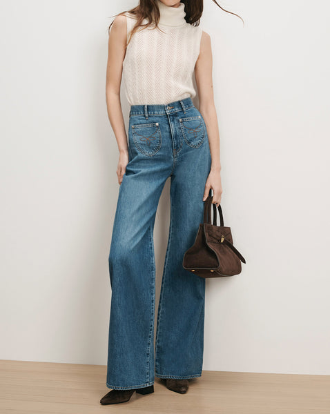 Veronica Beard Blue wide-leg jeans with embroidered pockets.
