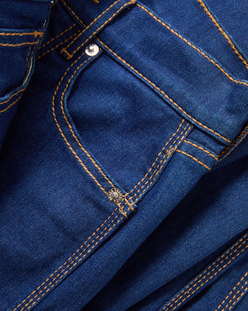 Veronica Beard Blue denim jeans with orange stitching and silver button.