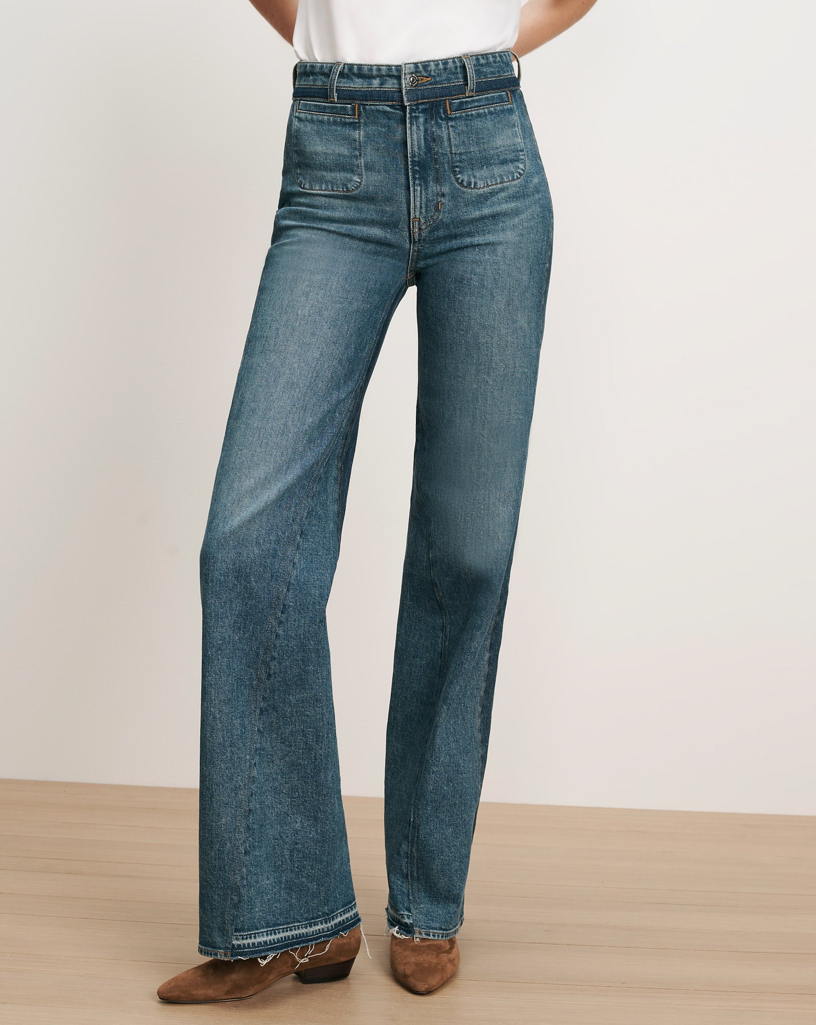 Veronica Beard Blue denim wide-leg jeans with front patch pockets.