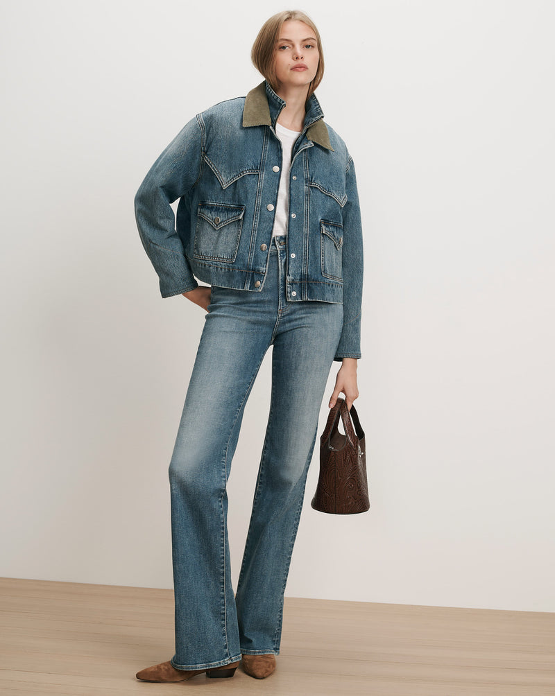 Veronica Beard Blue denim jacket and jeans, white t-shirt, brown handbag.