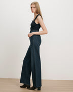 Veronica Beard Dark wash wide-leg jeans and black ribbed tank top.