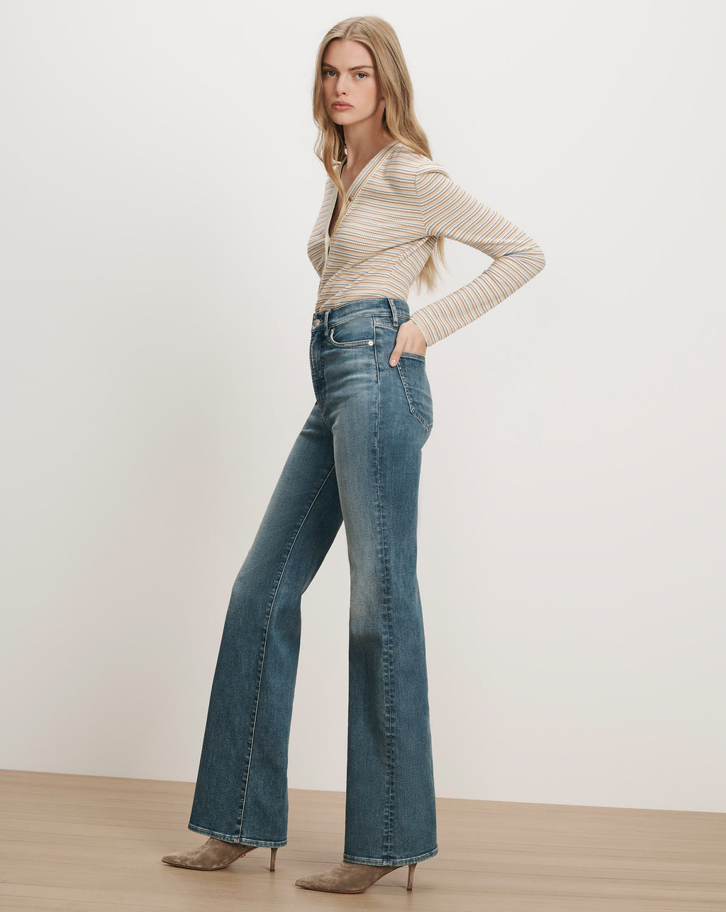 Veronica Beard Striped long-sleeve top and flared jeans.