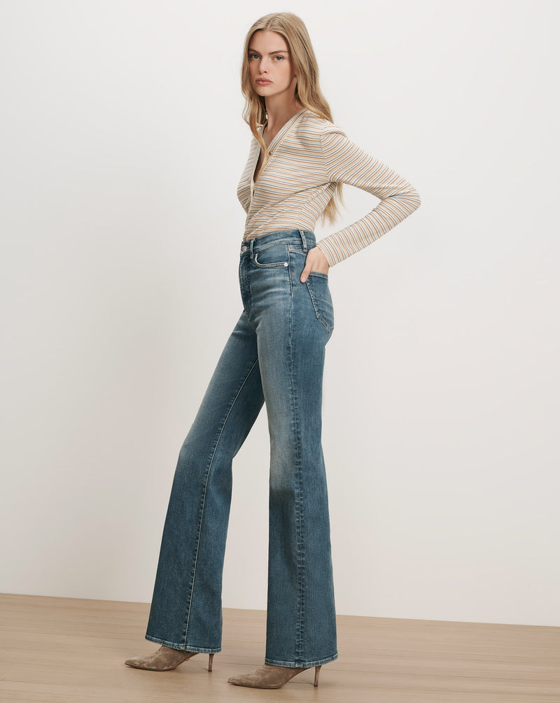 Veronica Beard Striped long-sleeve top and flared jeans.