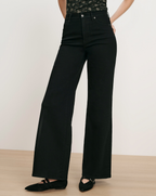 Veronica Beard Black wide-leg jeans with a high waist.