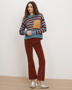 Veronica Beard Striped sweater with a pocket and brown corduroy pants.