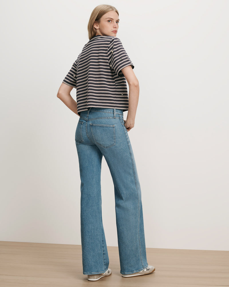Veronica Beard Blue and white striped knit top and blue jeans.