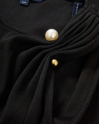 Veronica Beard Black ribbed top with pearl and gold buttons.