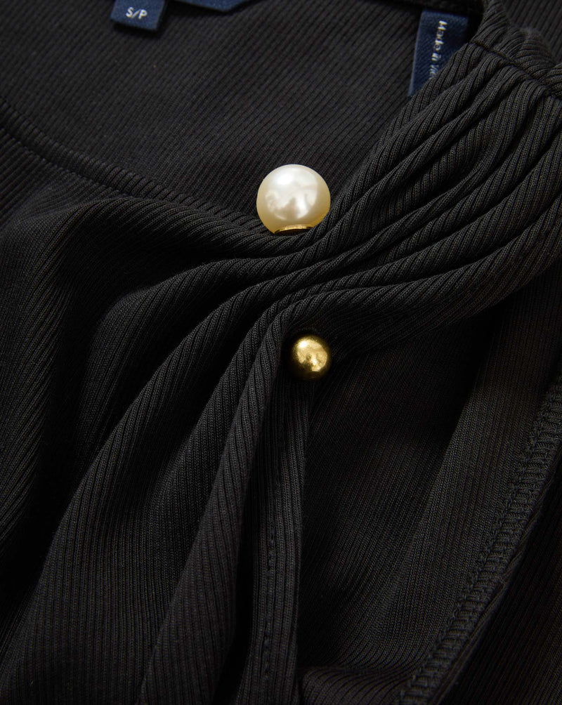 Veronica Beard Black ribbed top with pearl and gold buttons.