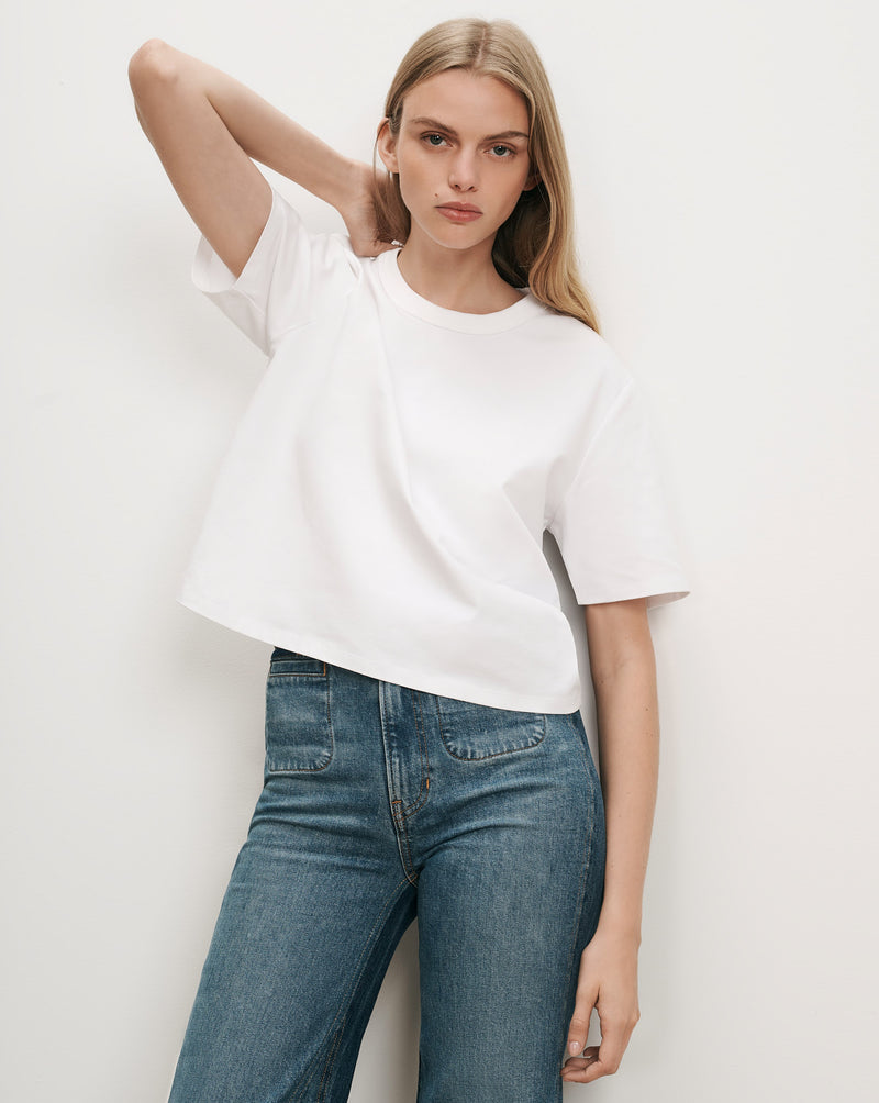 Veronica Beard White cotton crewneck t-shirt and blue jeans.
