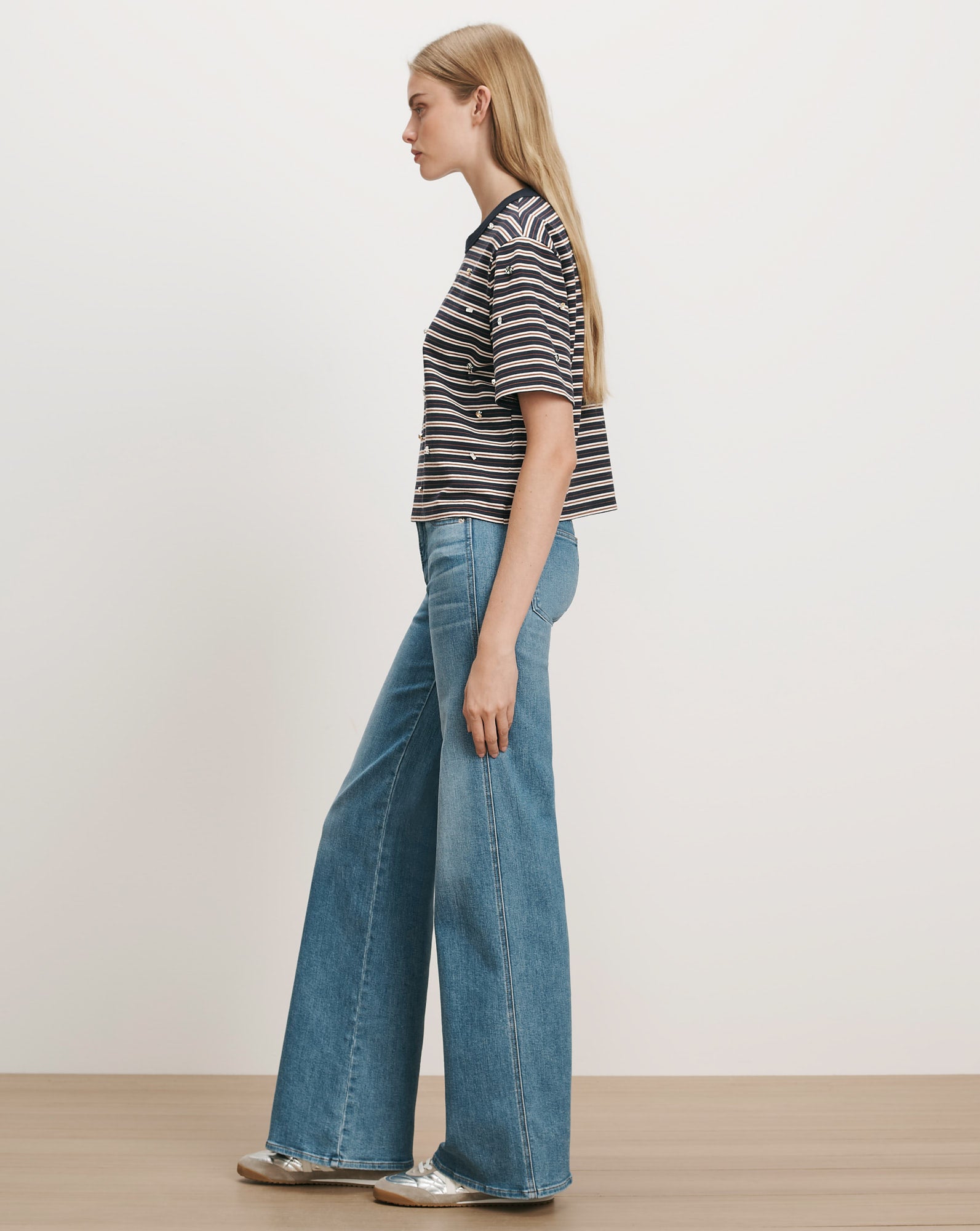 Veronica Beard Navy striped knit tee and wide-leg jeans.