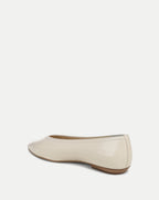 Veronica Beard Cream patent leather ballet flat with a low heel.