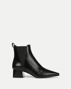 Veronica Beard Black leather Chelsea boots with a pointed toe and block heel.