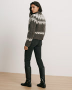 Veronica Beard Gray fair isle sweater, black jeans, black leather boots.