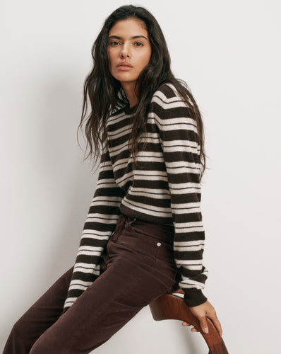 Veronica Beard Brown and white striped sweater, brown corduroy pants.
