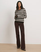 Veronica Beard Brown and white striped sweater, brown corduroy pants.