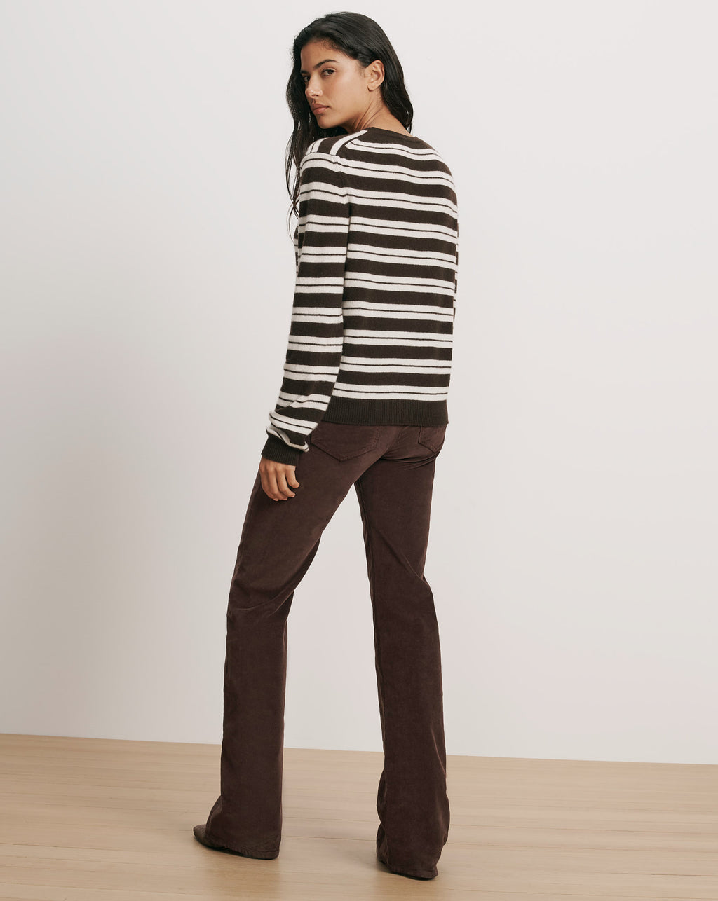 Veronica Beard Brown and white striped sweater, brown corduroy pants.