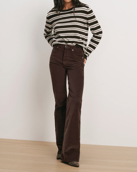 Veronica Beard Brown corduroy flare pants and striped long-sleeve shirt.
