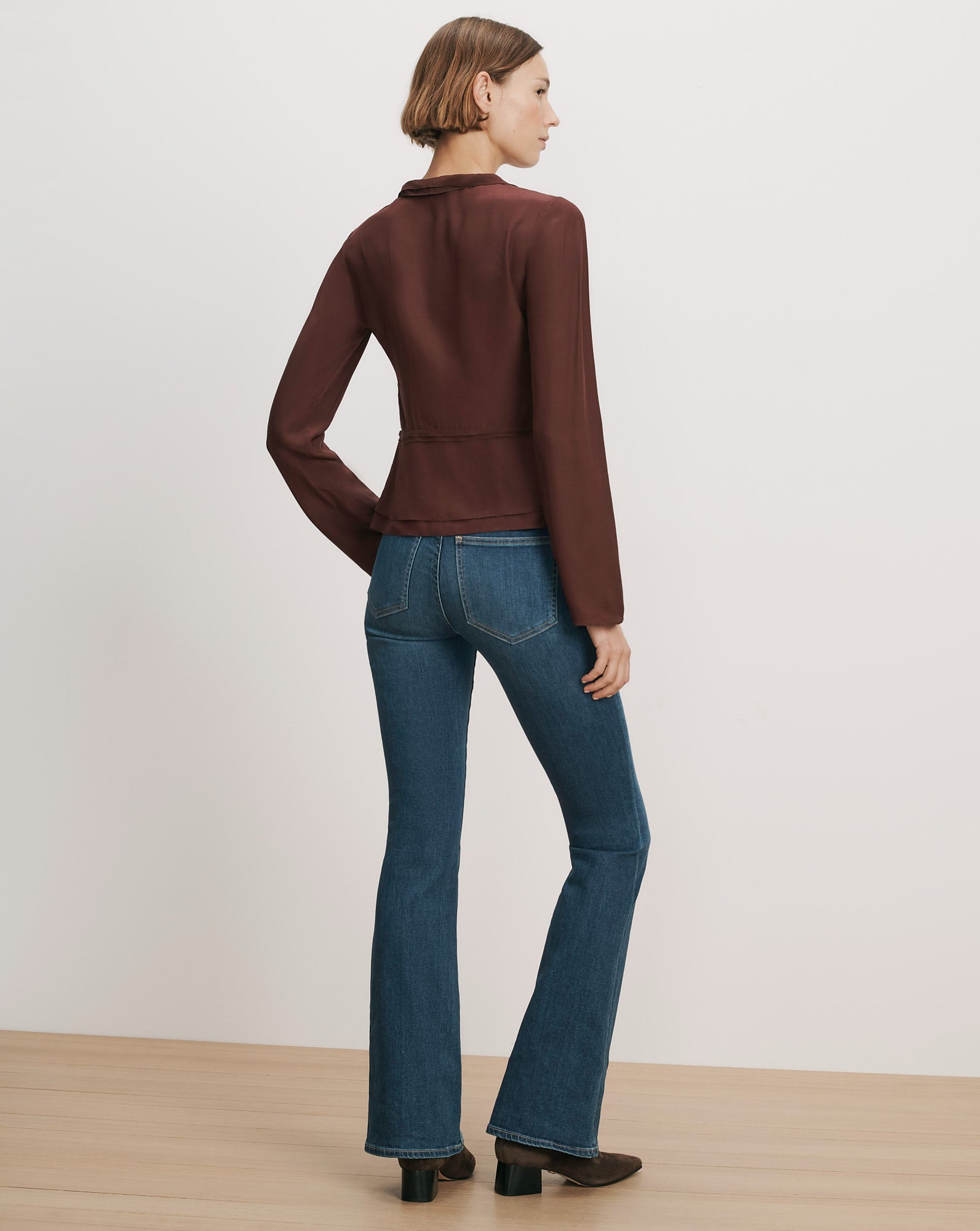 Veronica Beard Brown silk peplum blouse with long sleeves.