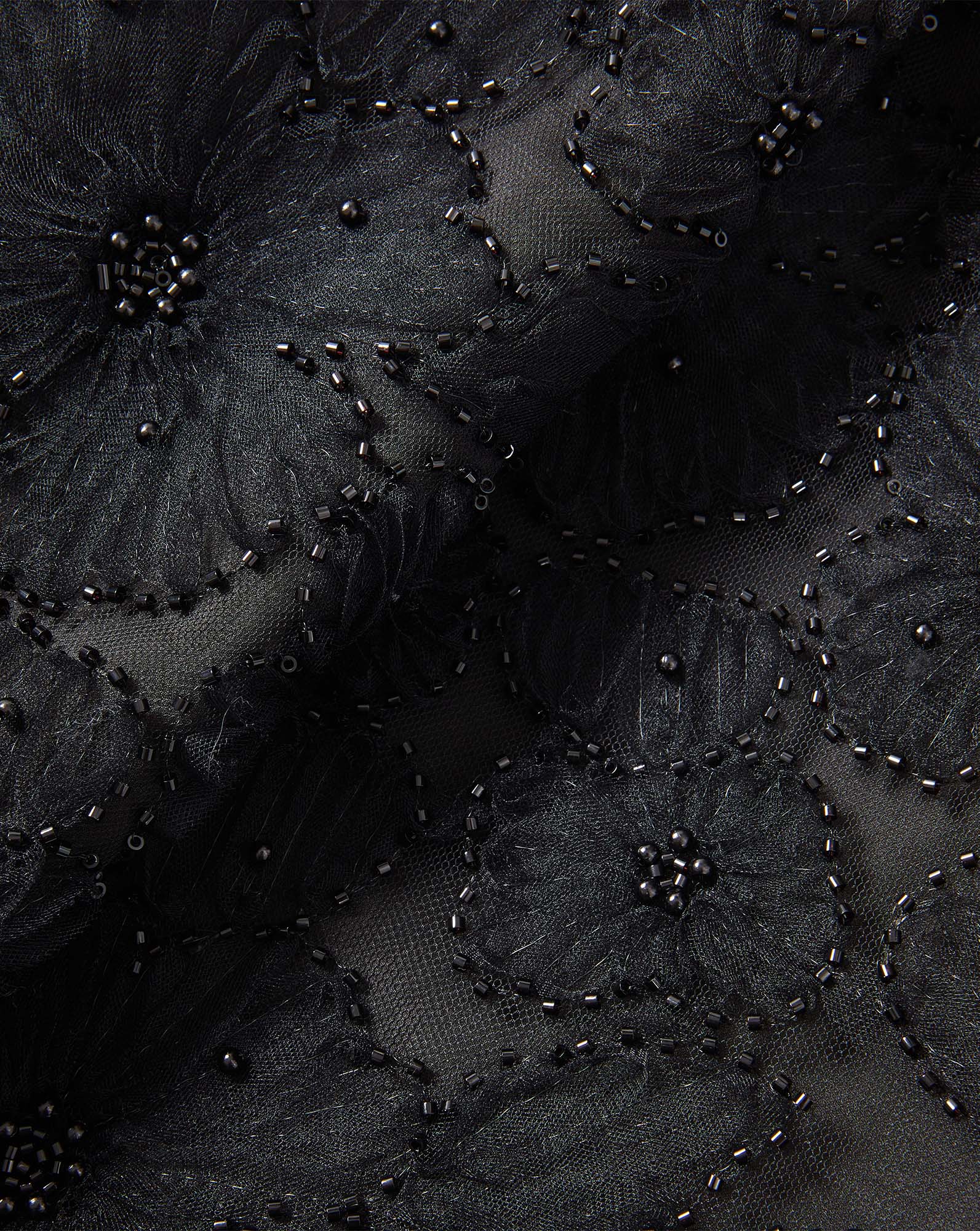 Veronica Beard Black beaded floral mesh fabric.