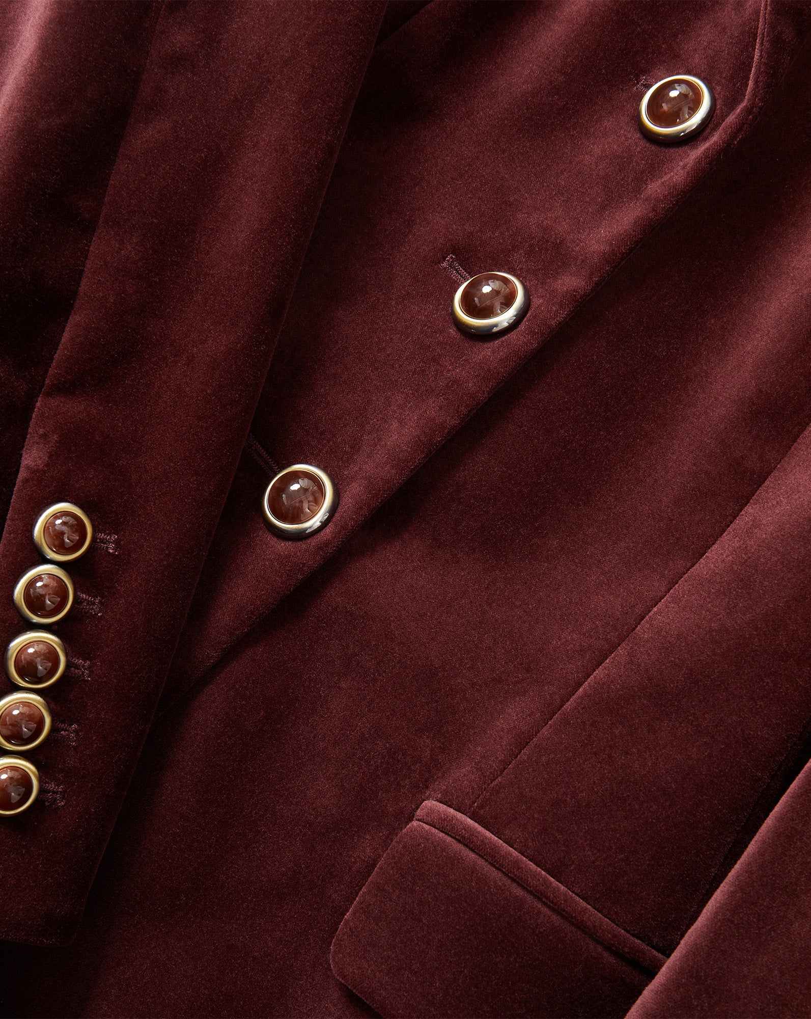 Veronica Beard Burgundy velvet blazer with gold-rimmed buttons.
