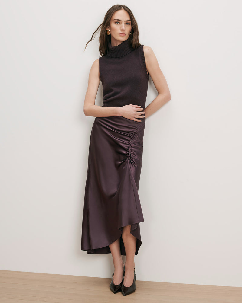 Veronica Beard Purple sleeveless turtleneck and satin ruched skirt.