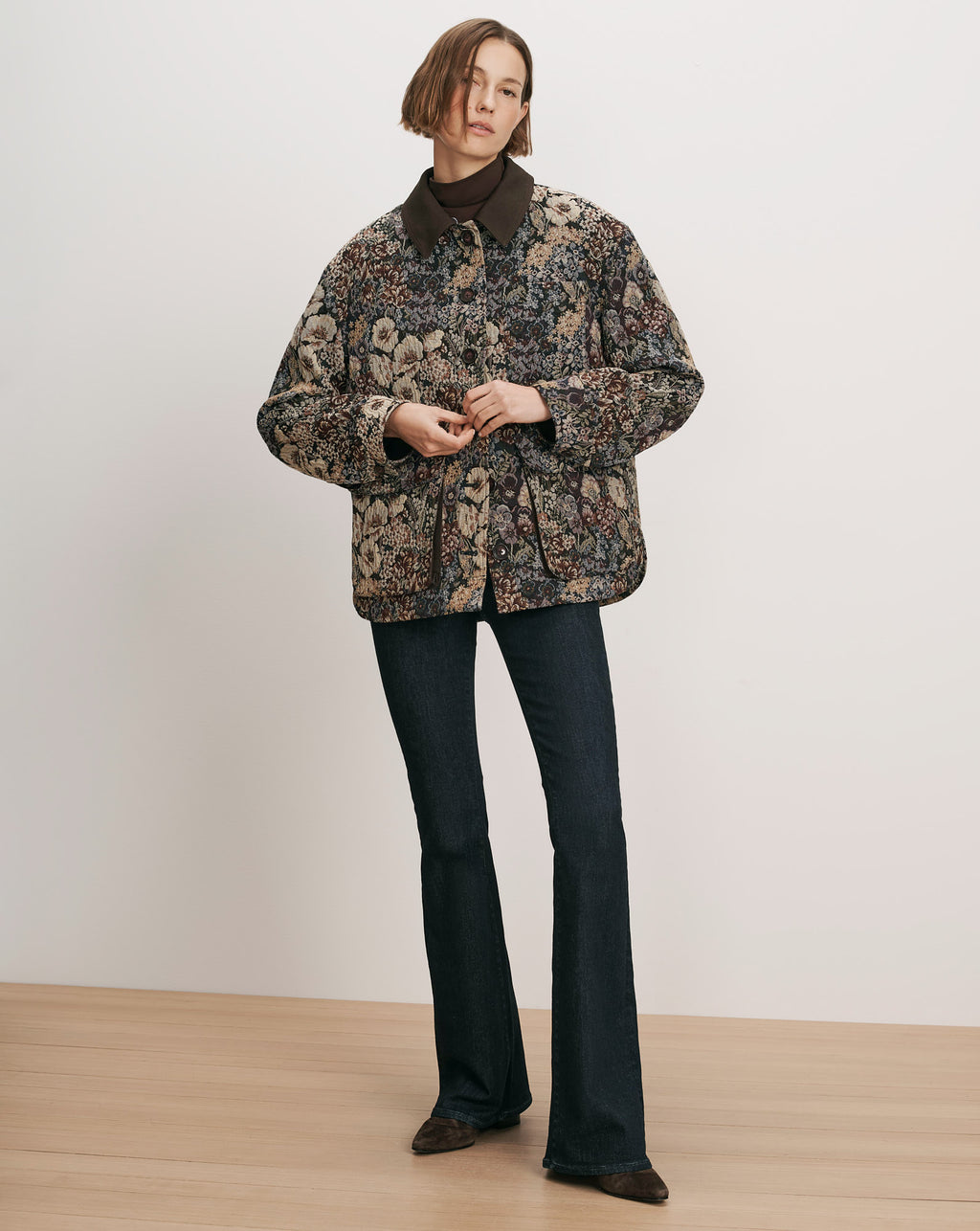 Veronica Beard Brown floral tapestry jacket with dark wash jeans.
