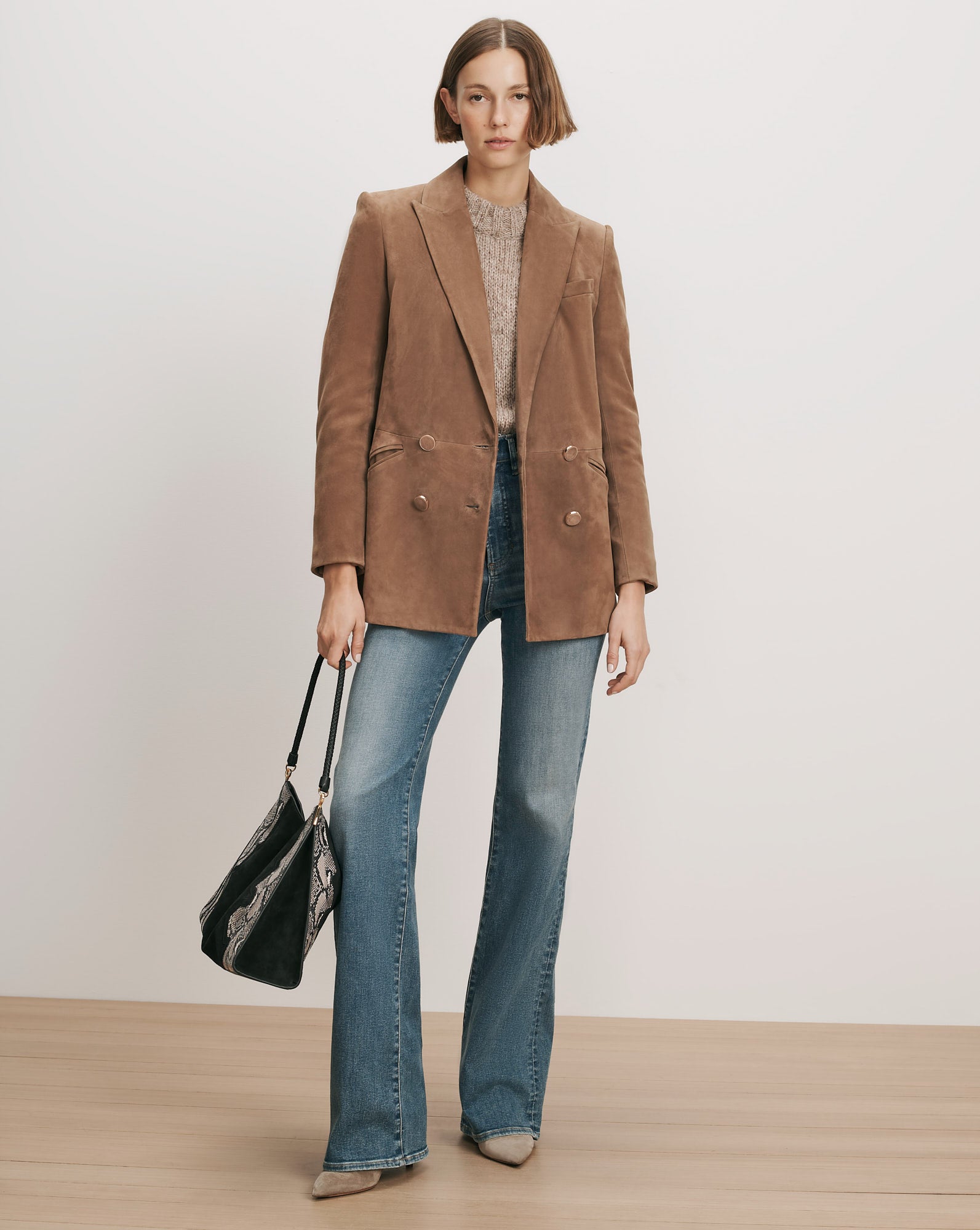 Veronica Beard Brown suede double-breasted blazer, light wash flare jeans.