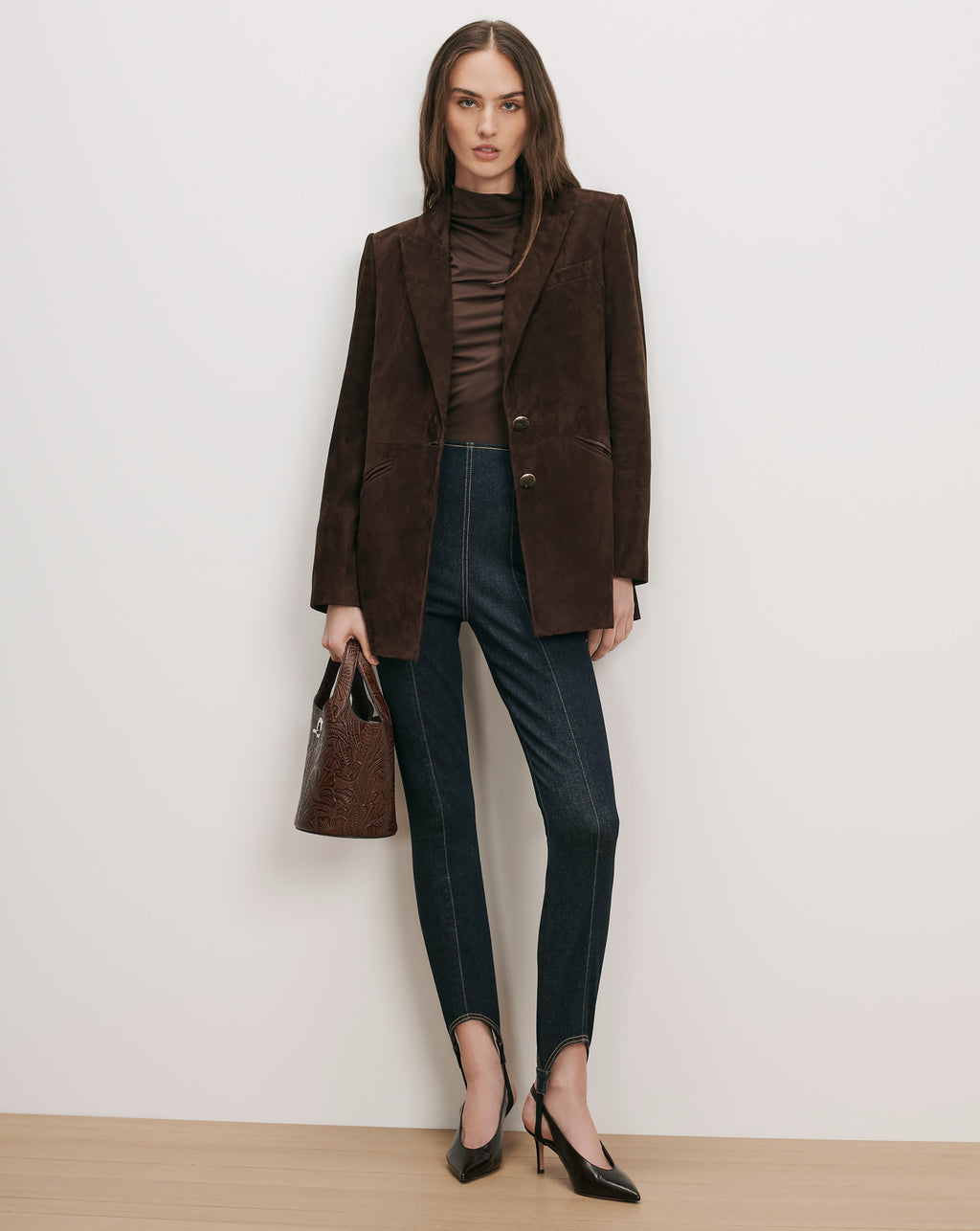 Veronica Beard Brown suede blazer, brown turtleneck, dark wash stirrup leggings.