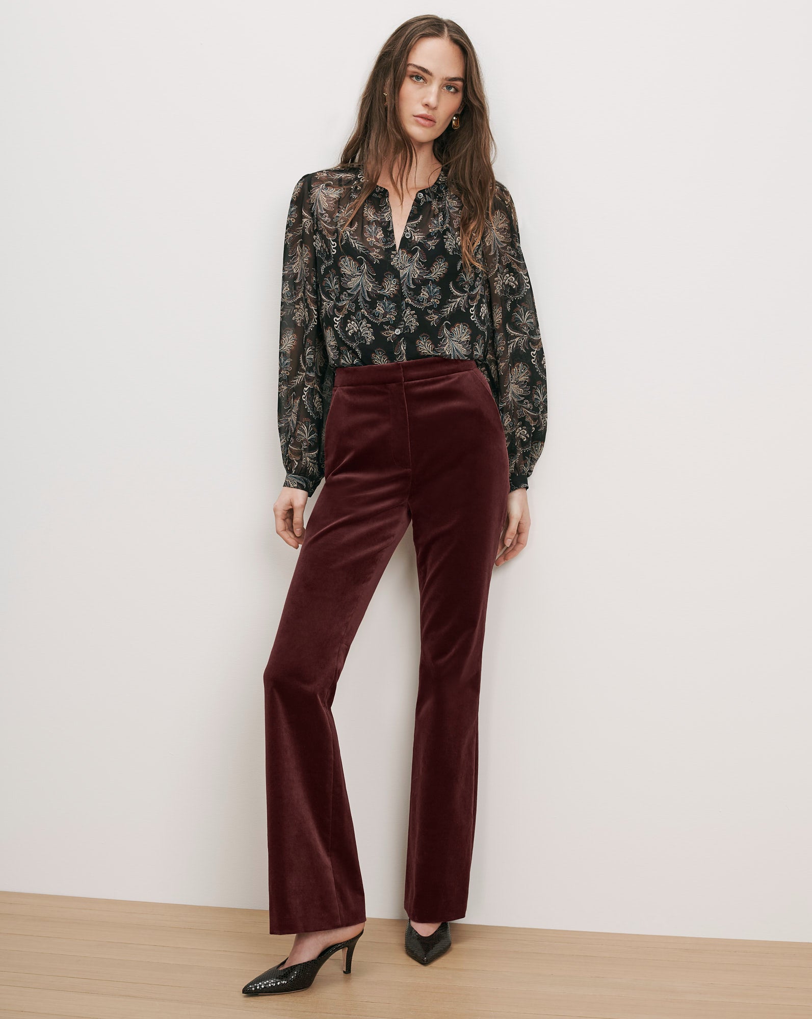 Veronica Beard Brown velvet flared pants and black sheer paisley blouse.