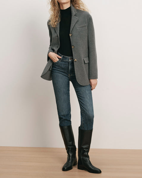 Veronica Beard Grey wool blazer with buttons over black turtleneck.