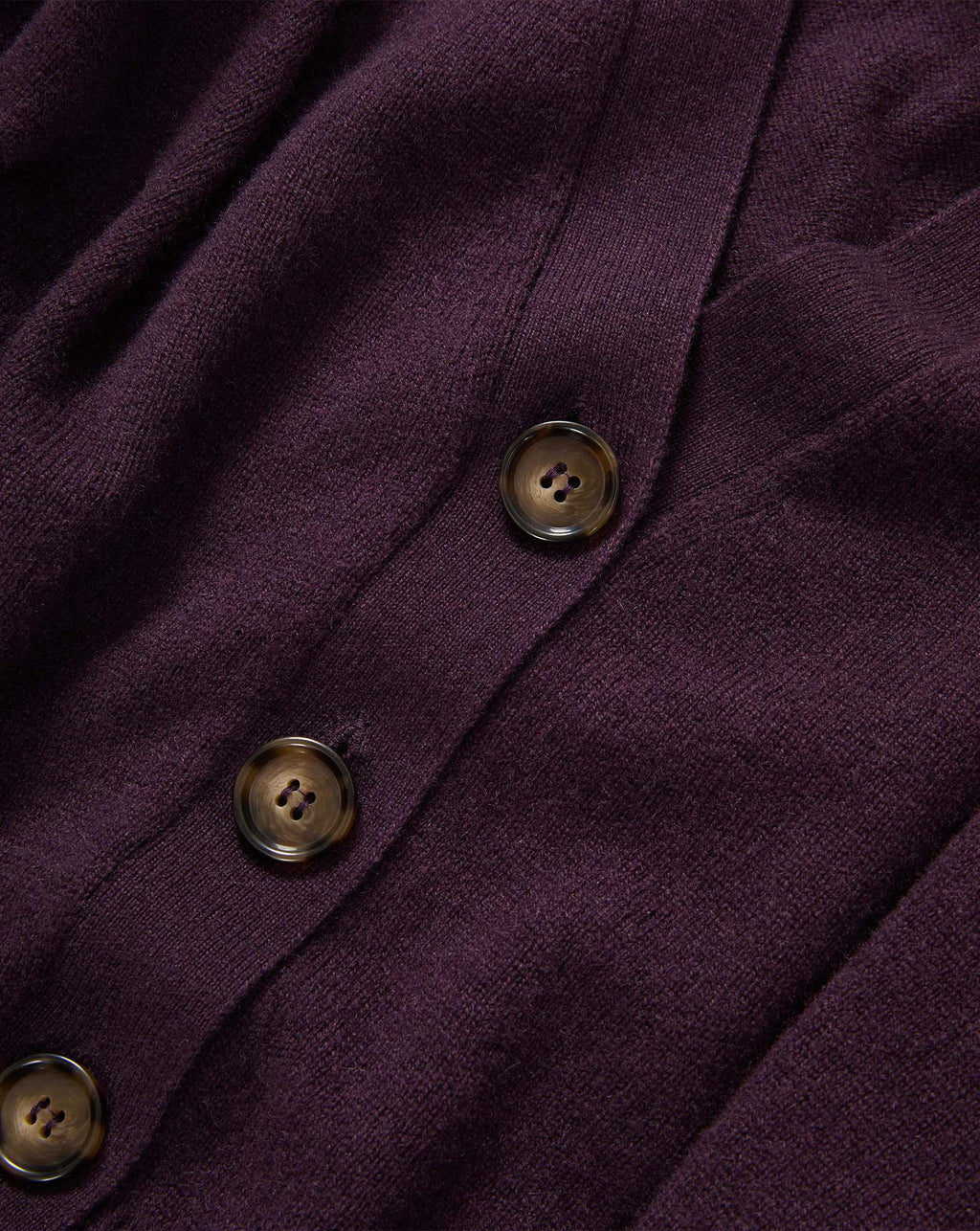 Veronica Beard Purple knit cardigan with brown buttons.