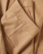 Veronica Beard Tan textured fabric folded with pleats.