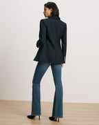 Veronica Beard Navy blazer, gold buttons, and flared jeans.