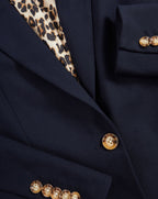 Veronica Beard Navy blazer with leopard print lining and tortoise buttons.