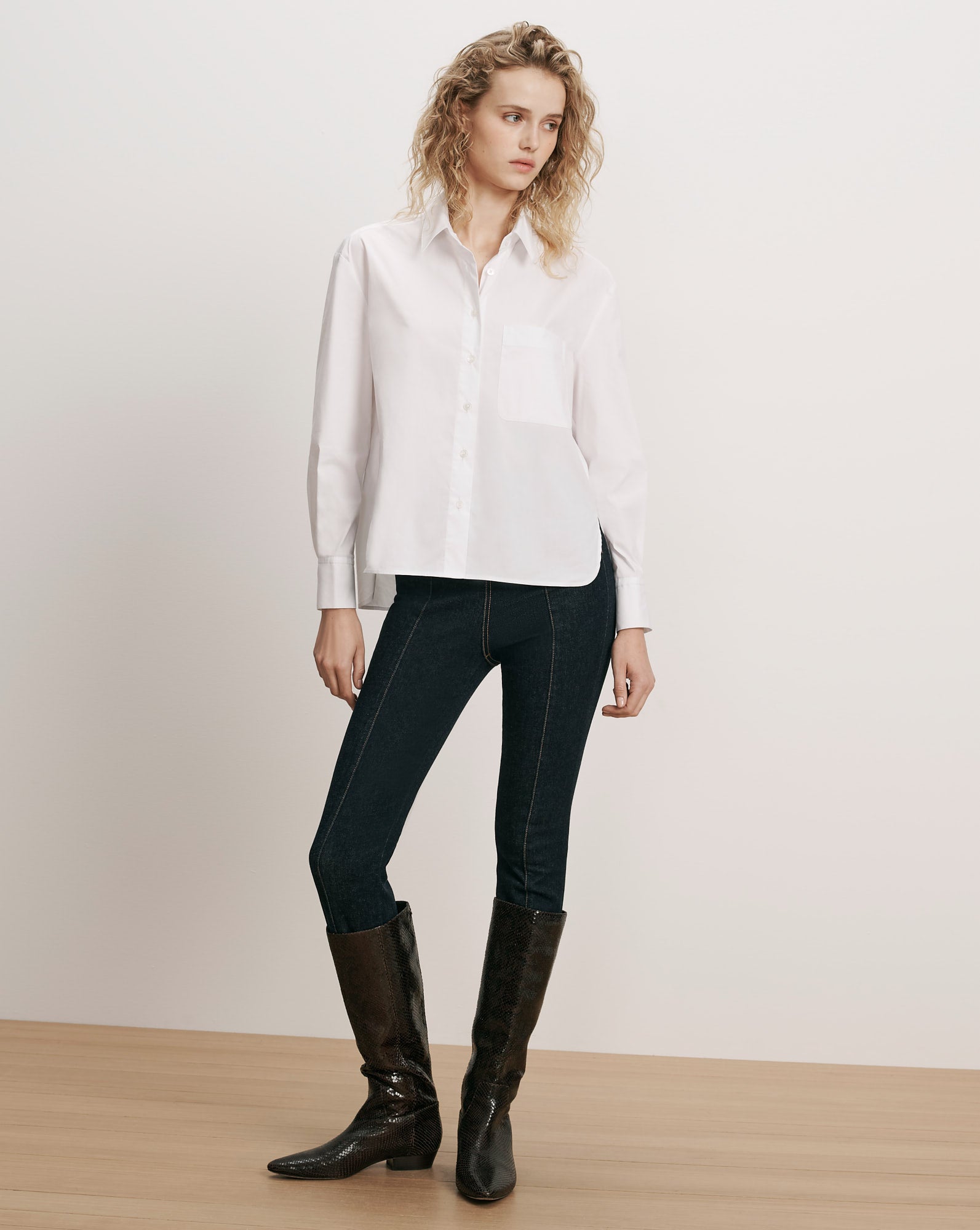 Veronica Beard White cotton button-down shirt, dark wash denim leggings.