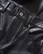 Veronica Beard Black faux leather pants with silver button details.