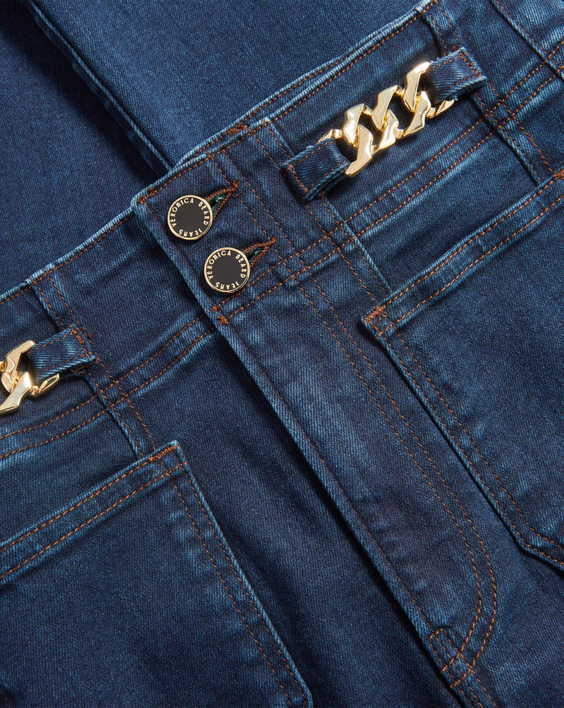 Veronica Beard Blue denim jeans with gold chain and buttons.