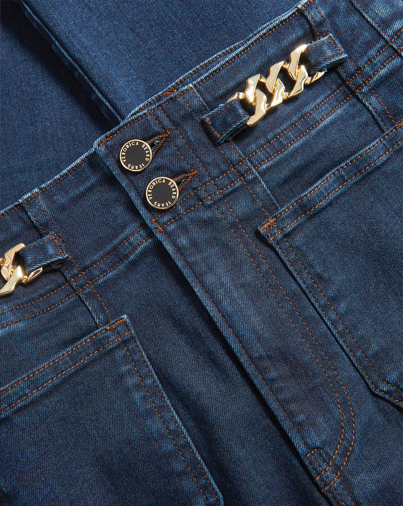 Veronica Beard Dark wash jeans with gold chain belt loops.