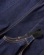 Veronica Beard Dark blue denim garment with orange contrast stitching.