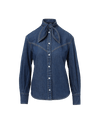 Veronica Beard Blue denim shirt with a pussy-bow collar.