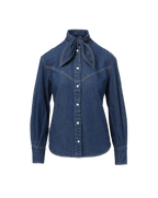 Veronica Beard Blue denim shirt with a pussy-bow collar.