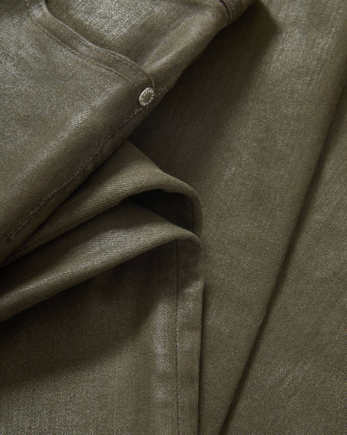 Veronica Beard Olive green coated denim pants detail.